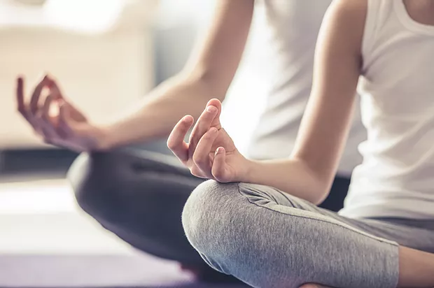 Two people meditating