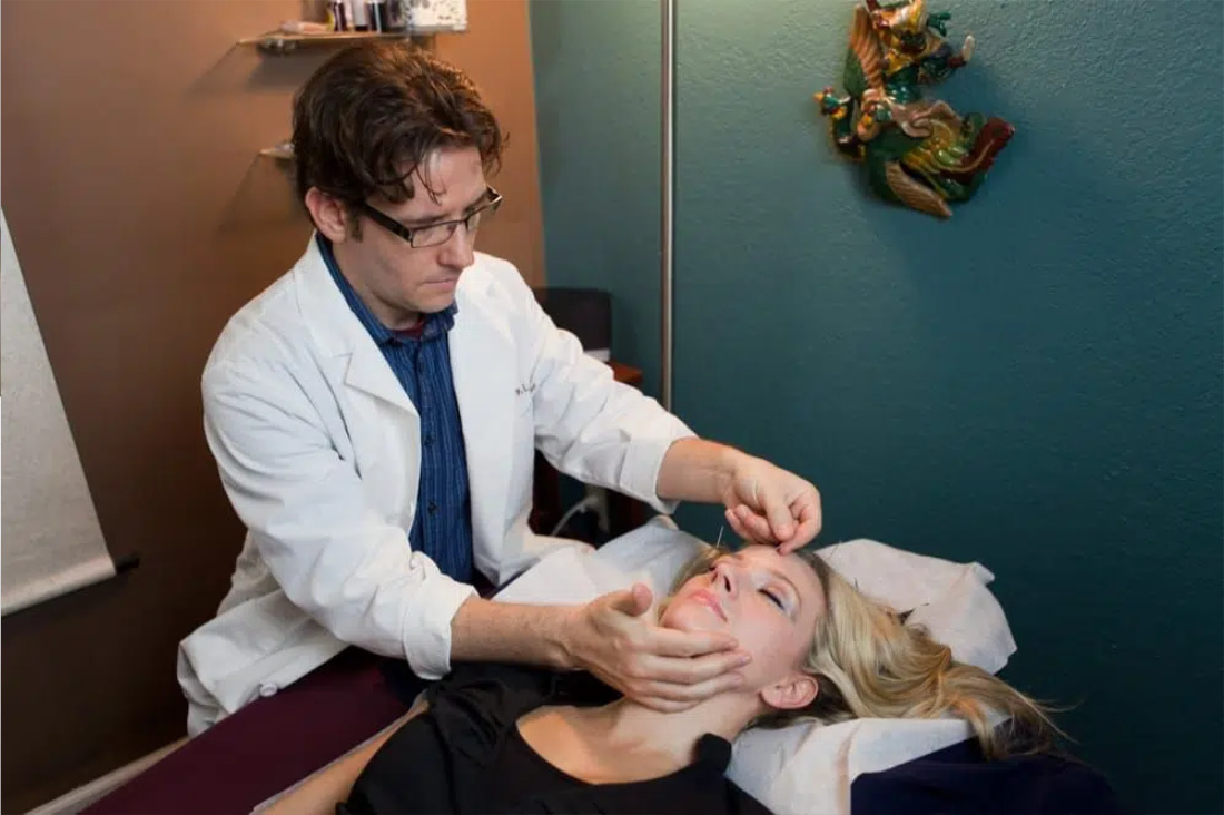 Muki Ramsey acupuncture with patient